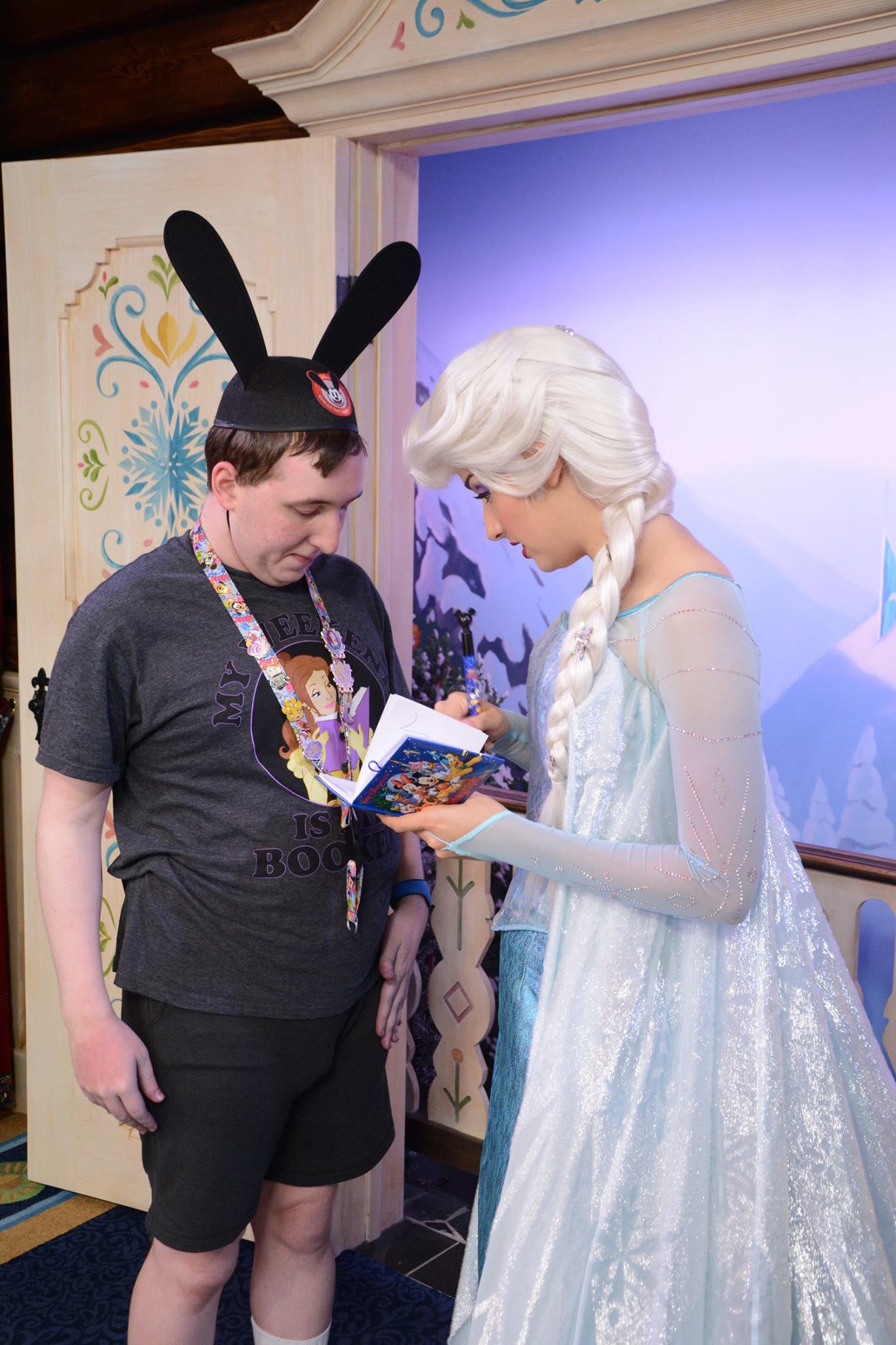 Elsa signing my autograph book