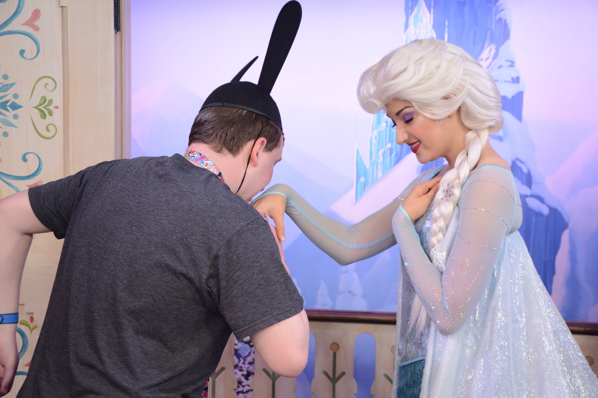 Kissing Elsa's hand