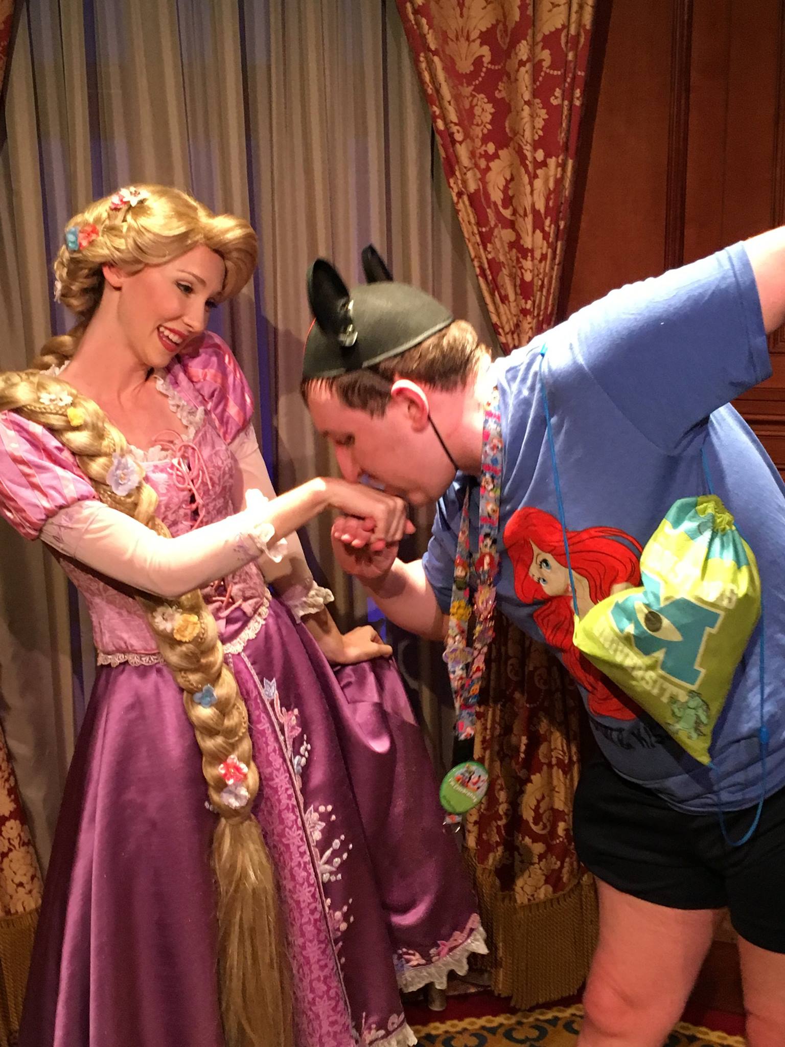 Kissing Rapunzel's hand