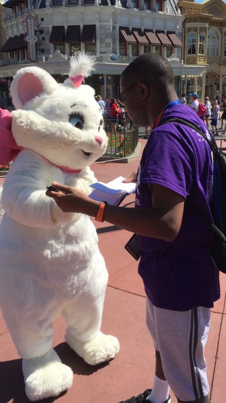 Marie handing back my autograph book (May 2 2015)