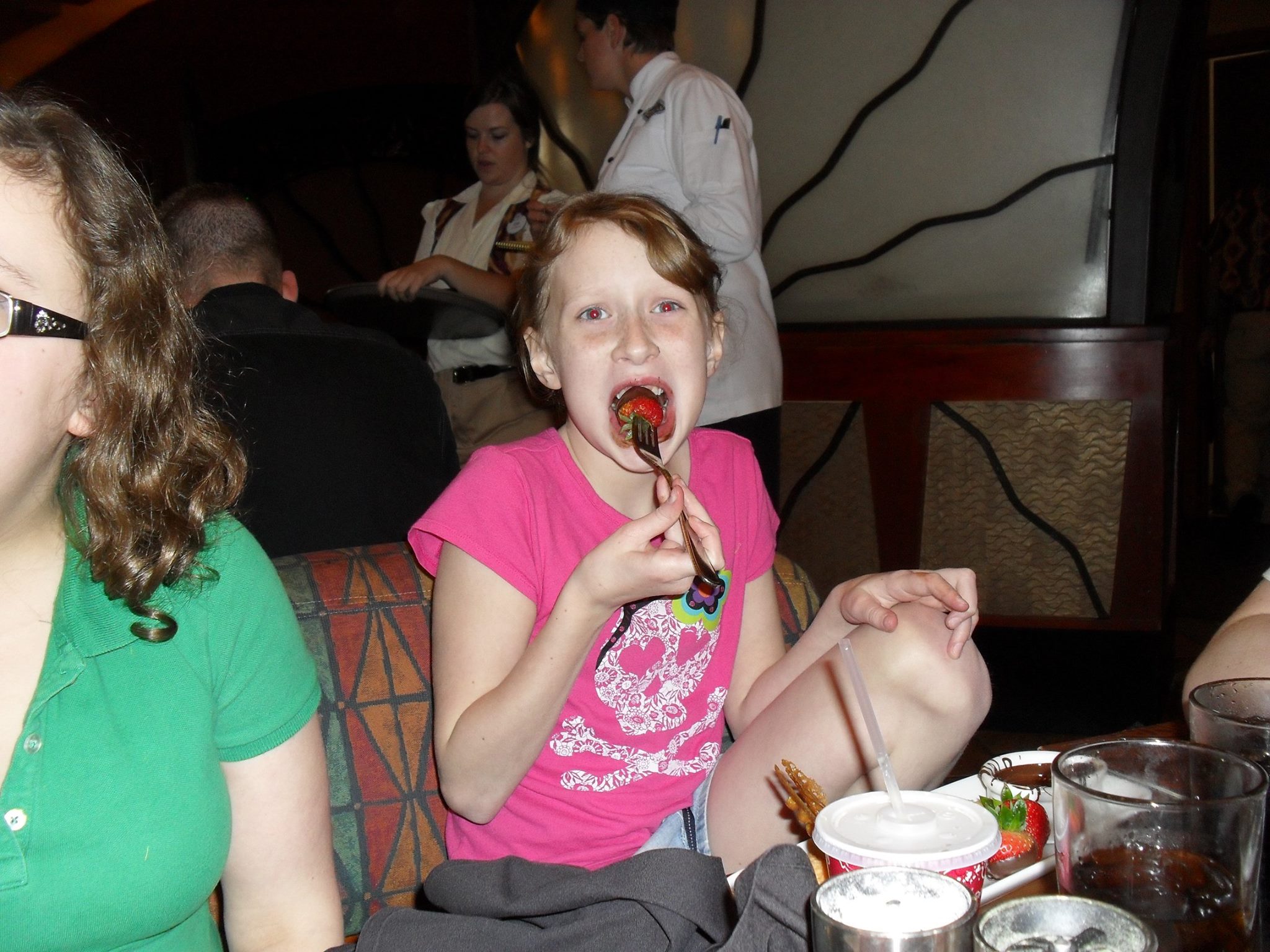 My little sister eating a Chocolate Strawberry